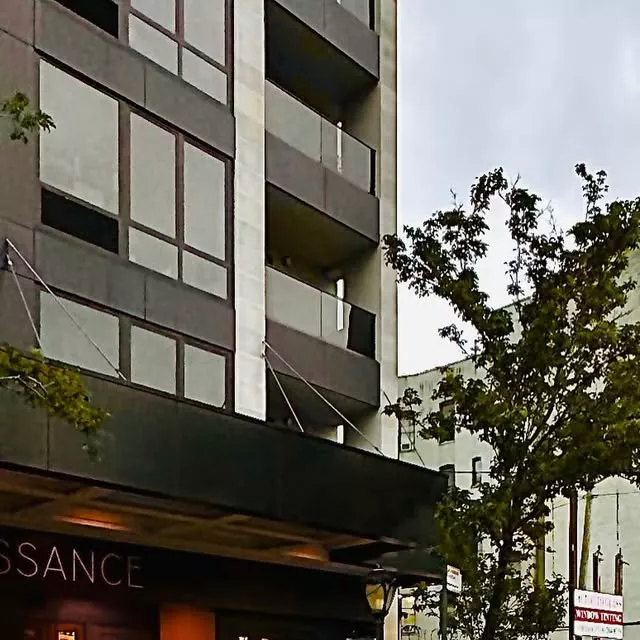 Entrance canopy of Renaissance Event Hall on a tree-lined street